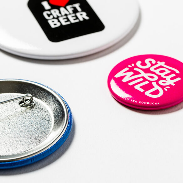 custom printed circular mac buttons close up pins