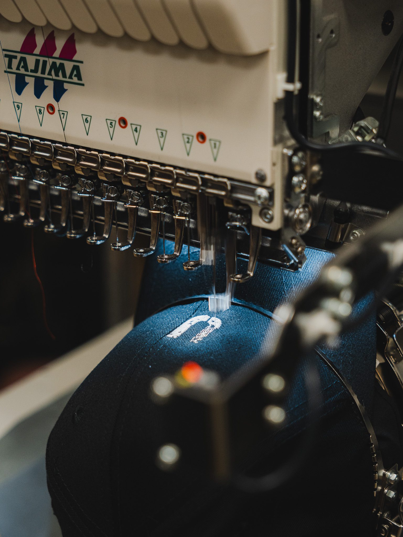 Custom Embroidery Services: Your New Design and Stitch to Impress by 10x "Go-To" Guide 1 Custom embroidery on promotional tshirts, jackets and hats. Featuring the custom embroidery machine that is on site and operated by a dedicated team member to ensure quality embroidered finishes.